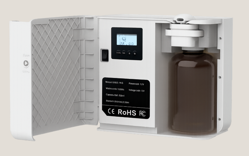 Diffusion unit with its door open, showing the display and fragrance bottle